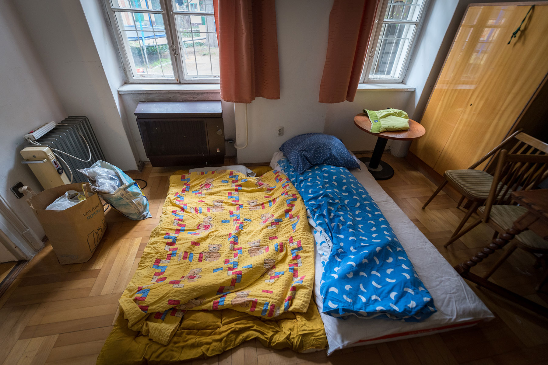 Beds made in an apartment arranged for incoming refugees from Ukraine, at Mandák house.